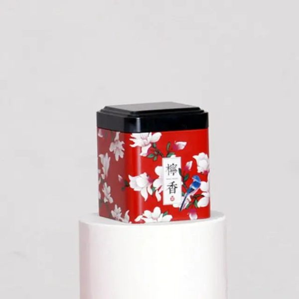 Boîte à thé métal rouge avec fleurs blanches