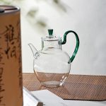 Théière en verre élégante avec anse colorée