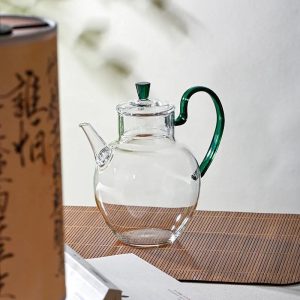 Théière en verre élégante avec anse colorée
