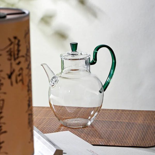 Théière en verre élégante avec anse colorée