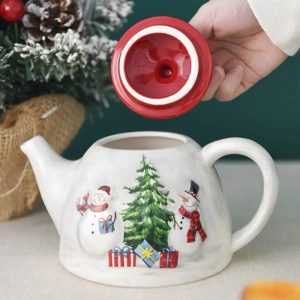 Théière festive avec motif de bonhommes de neige